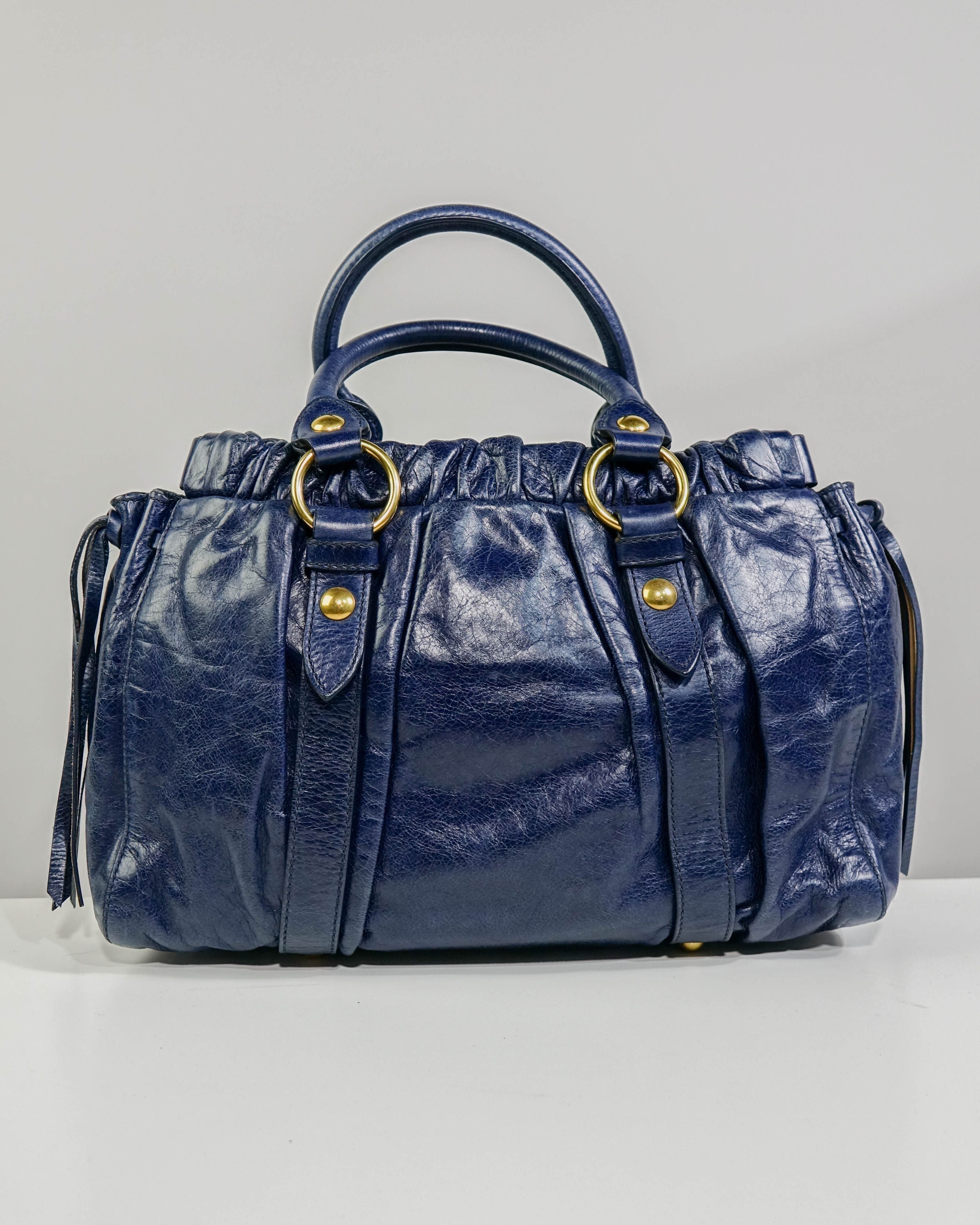 Sac 2way Miu Miu - bleu et gold Lola Collective