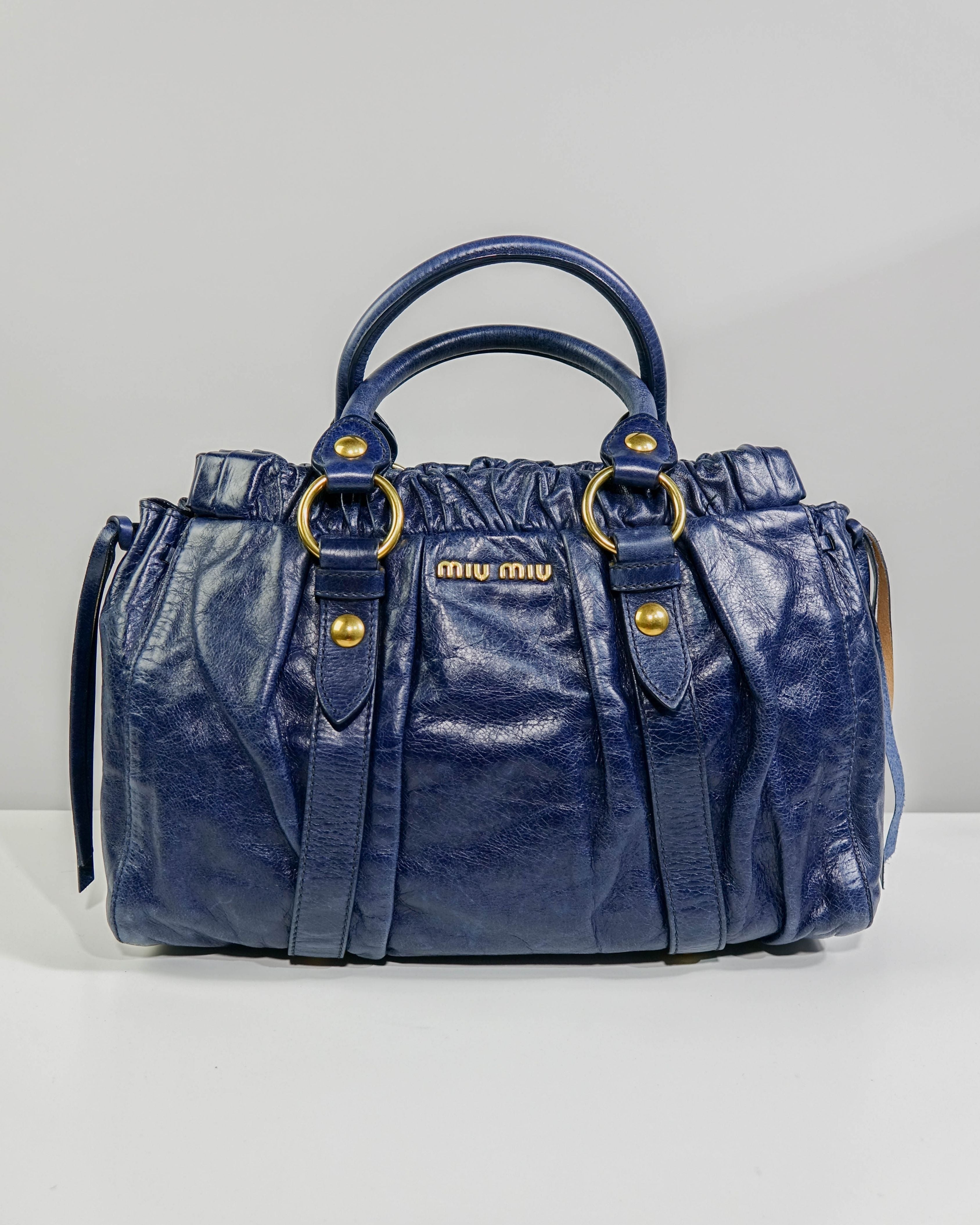 Sac 2way Miu Miu - bleu et gold Lola Collective