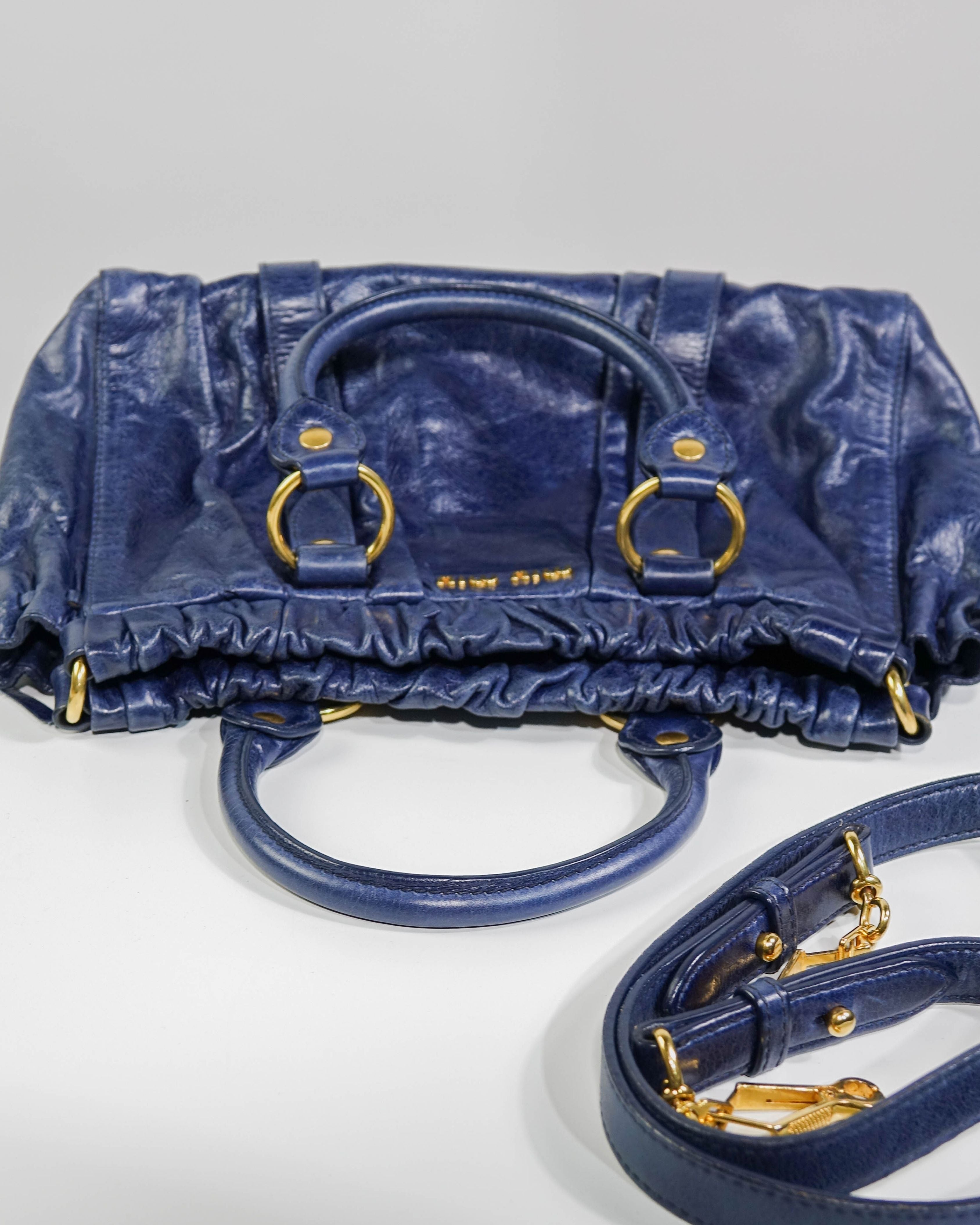 Sac 2way Miu Miu - bleu et gold Lola Collective